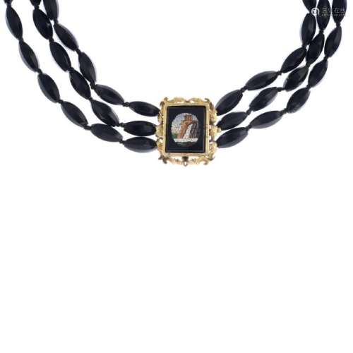 A glass bead three-row choker necklace. Comprising