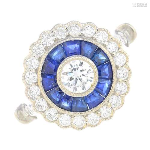 An 18ct gold sapphire and diamond cluster ring. The
