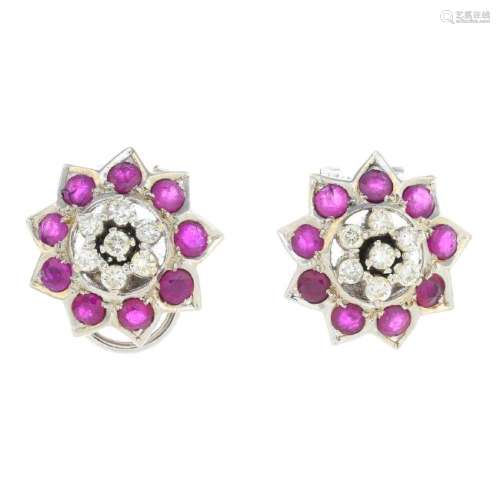 A pair of ruby and diamond cluster earrings. Each