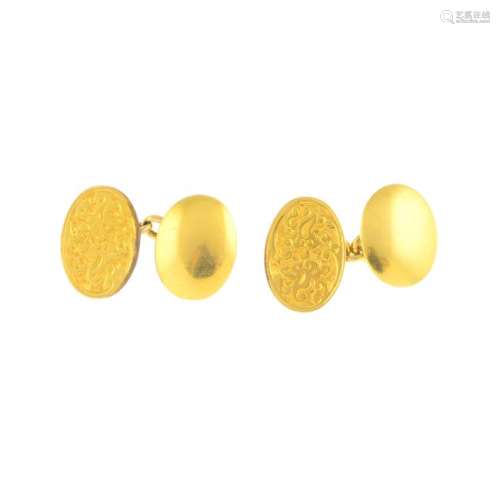 A pair of early 20th century gold cufflinks. Each