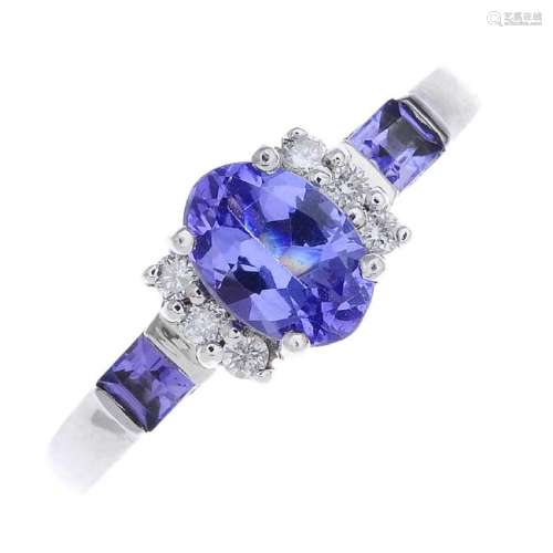 An 18ct gold tanzanite and diamond dress ring. The