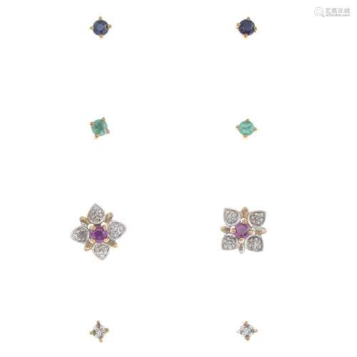 A set of interchangeable earrings. Comprising four sets