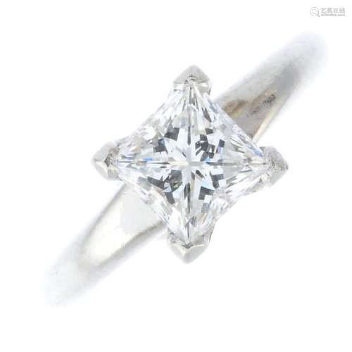 A platinum diamond single-stone ring. The square-shape