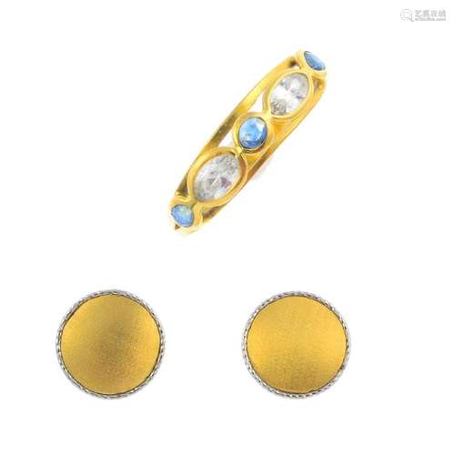 A gem-set ring and a pair of earrings. The ring