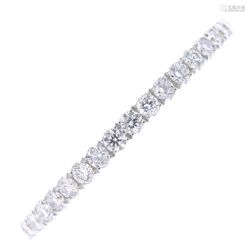 A diamond full eternity ring. The brilliant-cut diamond