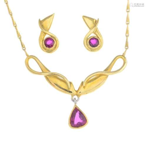 An 18ct gold ruby necklace and earrings. The necklace