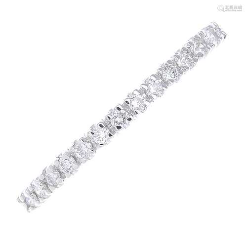 An 18ct gold diamond half eternity ring. The