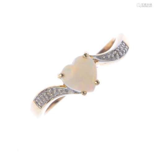A 9ct gold opal and diamond crossover ring. The