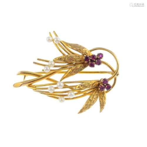 A 9ct gold ruby and seed pearl brooch. Designed as a