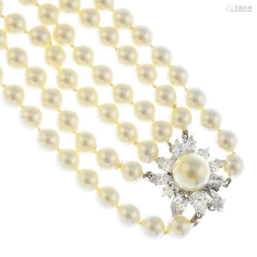 A four-row imitation pearl necklace. Comprising four