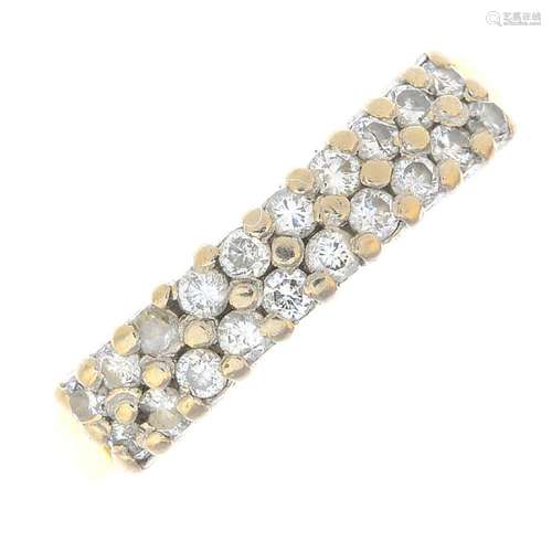 An 18ct gold diamond half eternity ring. Designed as