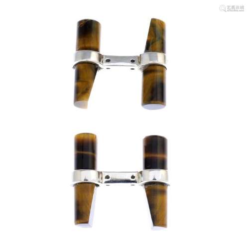 A pair of tiger's-eye cufflinks. Each designed as two