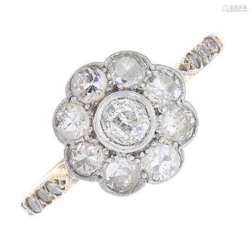 A diamond cluster ring. The old-cut diamond floral