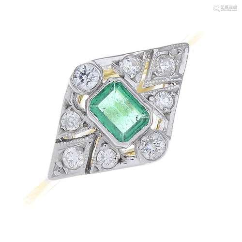 An emerald and diamond dress ring. The octagonal-shape