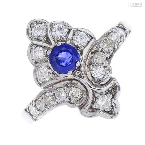 A 9ct gold sapphire and diamond dress ring. The