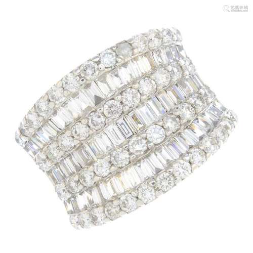 A diamond dress ring. Of concave design, the