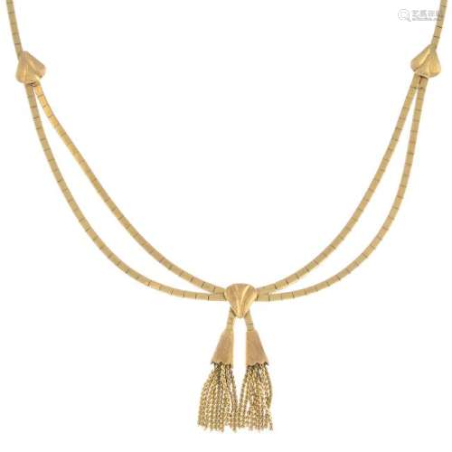 A necklace. The fancy-link tassels, suspended from a
