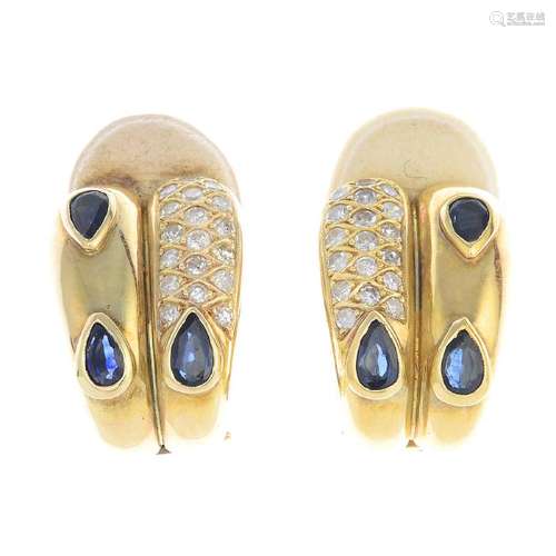 A pair of sapphire and diamond earrings. Each of