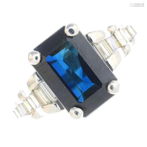A sapphire and diamond dress ring. The