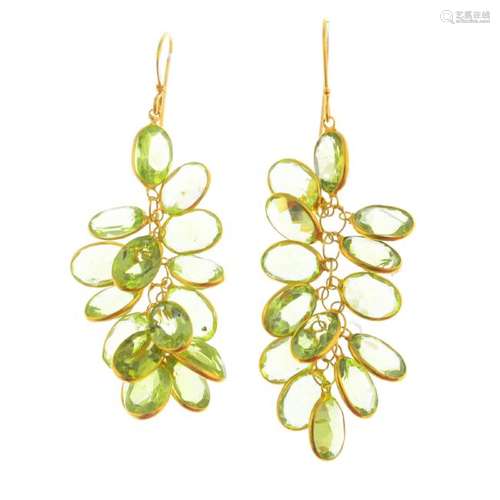 A pair of peridot  earrings. Each designed as a cluster