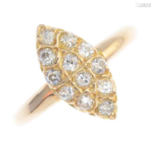 A diamond cluster ring. Of marquise-shape outline, the