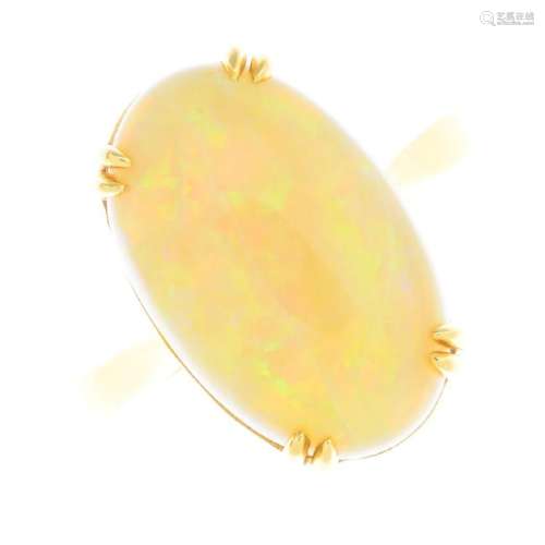 An opal single-stone ring. The oval opal cabochon, with