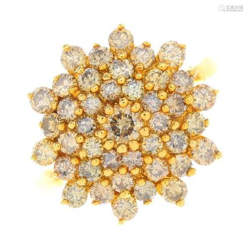 A 9ct gold diamond cluster ring. The brilliant-cut