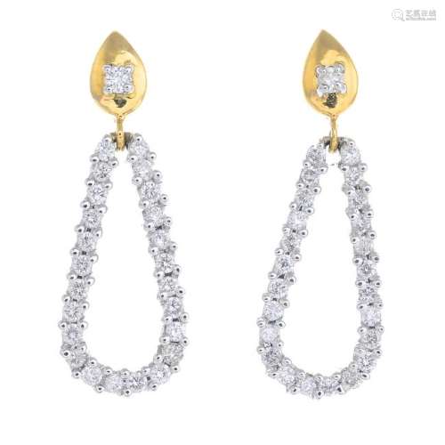 A pair of 18ct gold diamond earrings. Each designed as
