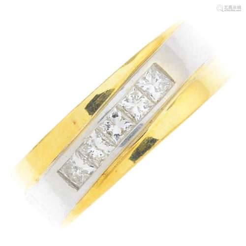 An 18ct gold diamond ring. Of bi-colour design, the
