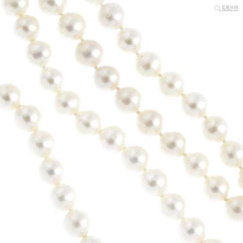 Four cultured pearl single-strand necklaces. Each