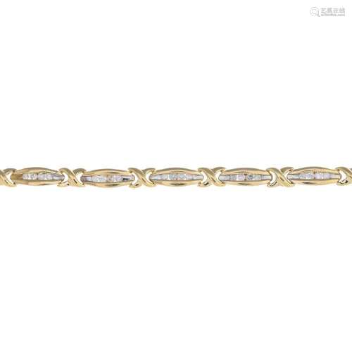 A 9ct gold diamond bracelet. Designed as a series of