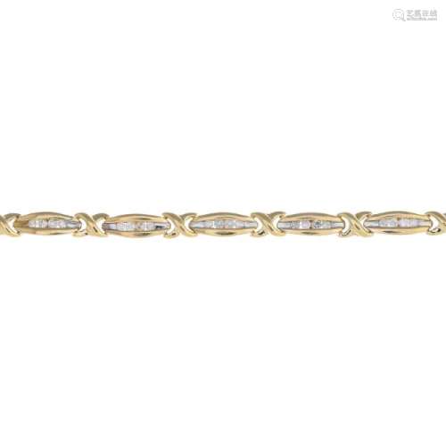 A 9ct gold diamond bracelet. Designed as a series of