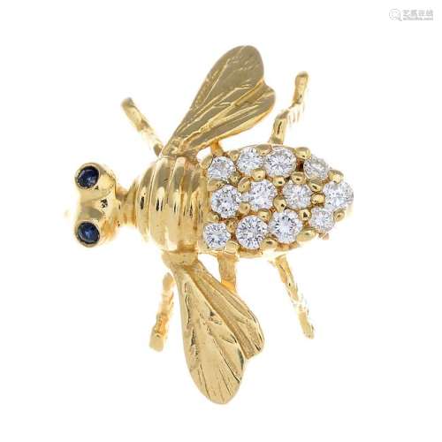 A diamond and sapphire bee brooch. Designed as a bee,