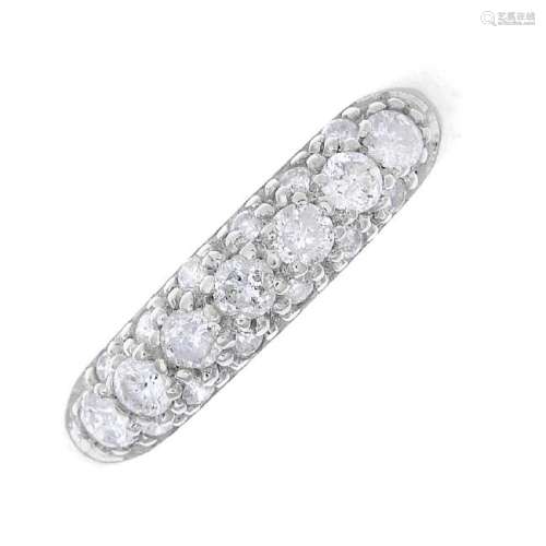 An 18ct gold diamond band ring. The pave-set diamond