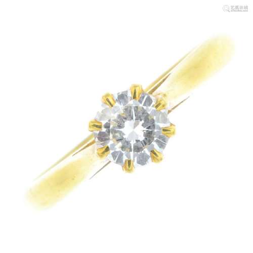 An 18ct gold diamond single-stone ring. The