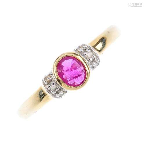 A 9ct gold diamond and ruby ring. The oval-shape ruby,
