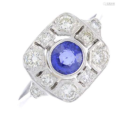 A sapphire and diamond cluster ring. The circular-shape