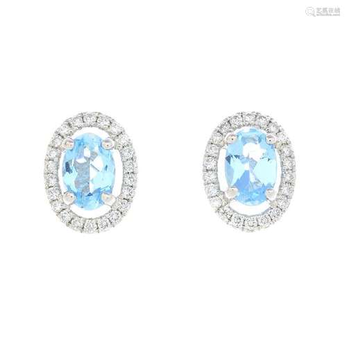 A pair of 18ct gold aquamarine and diamond earrings.