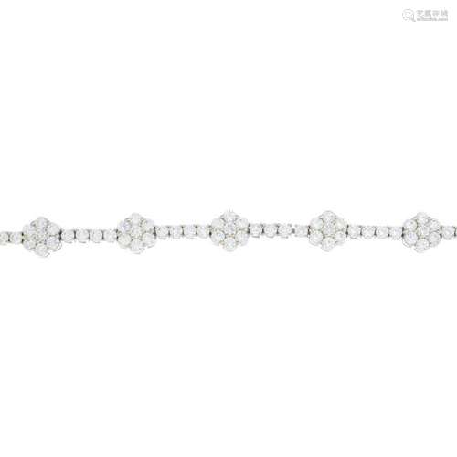 A 14ct gold cubic zirconia bracelet. Designed as a