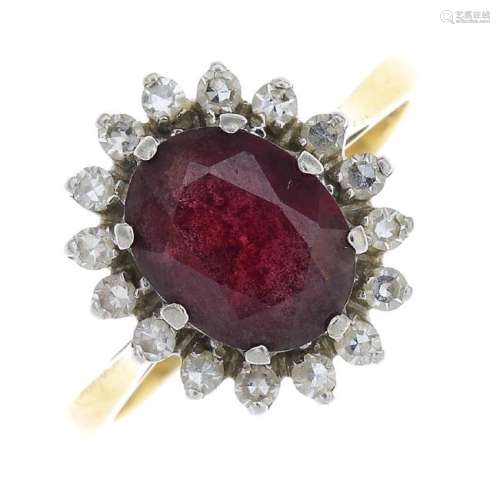 An 18ct gold garnet and cubic zirconia cluster ring.