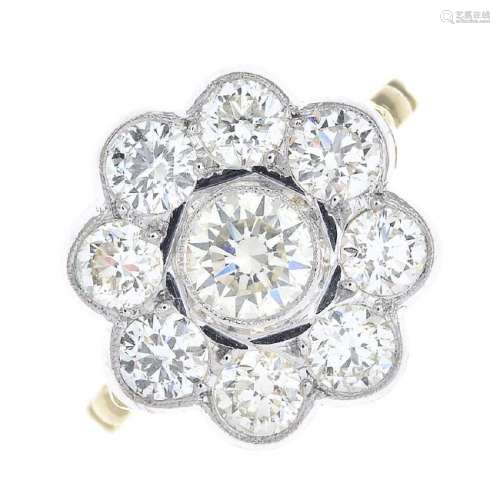 A diamond floral cluster ring. The brilliant-cut