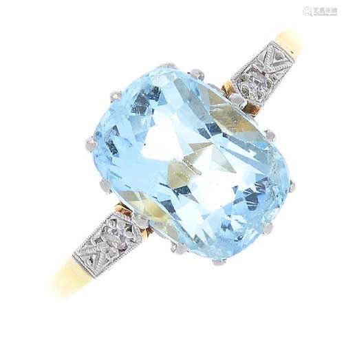 An aquamarine and diamond single-stone ring. The