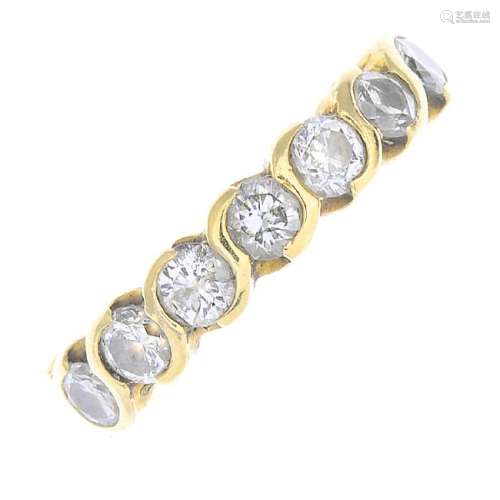 (53720) An 18ct gold diamond seven-stone ring. Designed