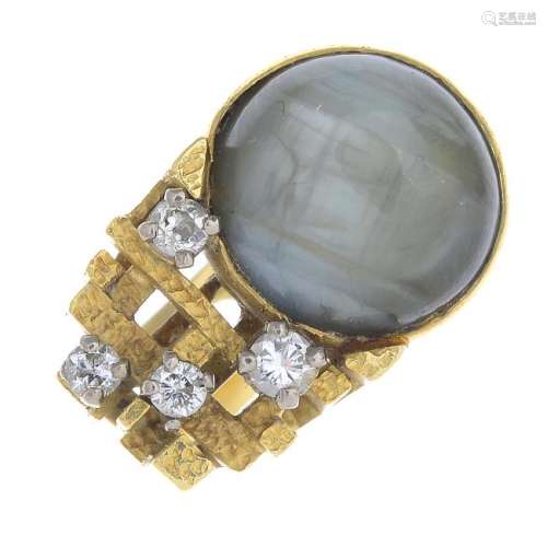 A chrysoberyl and diamond dress ring. Of asymmetric