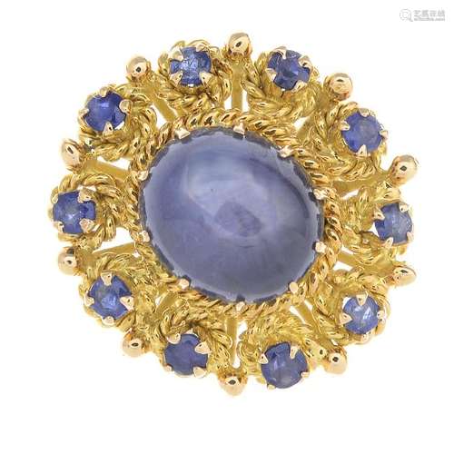 A star sapphire cluster ring. The oval star sapphire