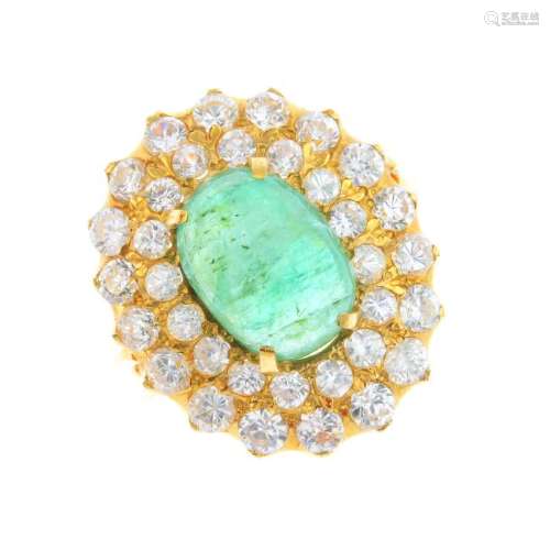 An 18ct gold emerald and cubic zirconia dress ring. The