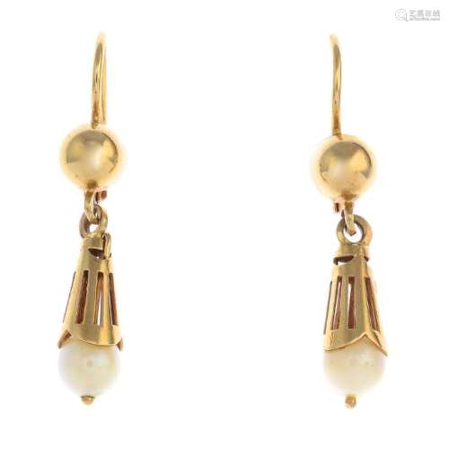 A pair of imitation pearl earrings. Each designed as an