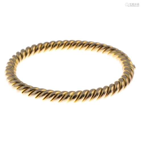 A hinged bangle. Of rope-twist design, with partially