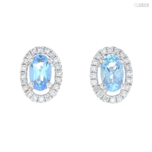 A pair of 18ct gold aquamarine and diamond earrings.