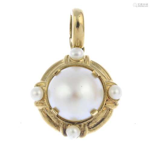 A mabe pearl and cultured pearl pendant. The mabe